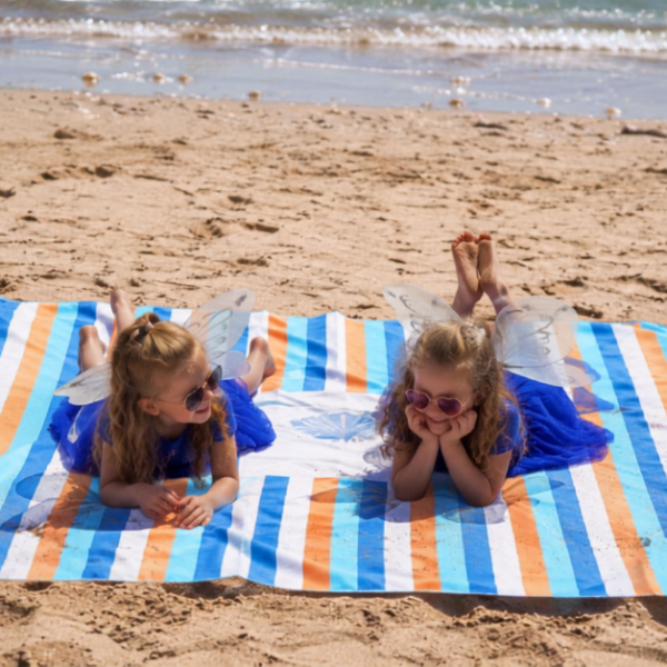BeachSupplies.co.uk sand-free beach and picnic blanket laid out on a beach — 180 x 220cm fast-drying microfibre