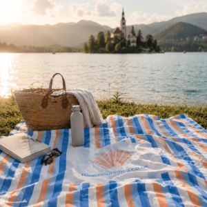 BeachSupplies.co.uk sand-free beach and picnic blanket laid out on a beach — 180 x 220cm fast-drying microfibre