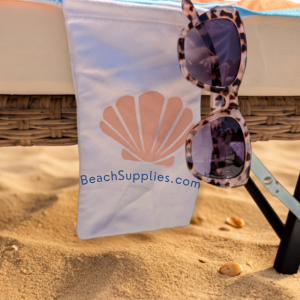 BeachSupplies.co.uk Sun Lounger Towel in use on a pool lounger — recycled rPET, 75 x 210cm with headrest pocket and storage pockets