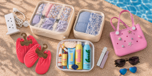 Family holiday essentials packed and ready, including towels, sunglasses and a travel bag